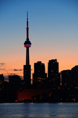 toronto city skyline silhouette sunset lake with urban skyscrapers